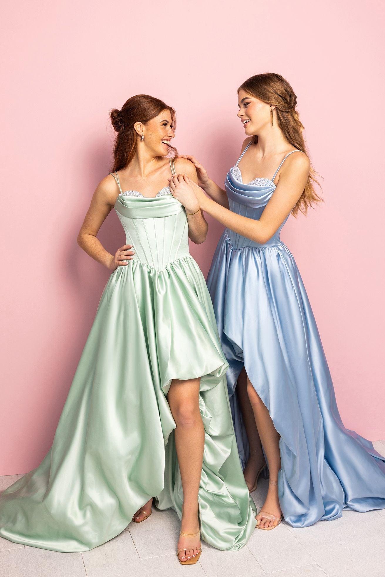 Two women in elegant dresses, KmzT8w7Q_050e460d-e99c-4540-a6d7-b722119ba5e6.