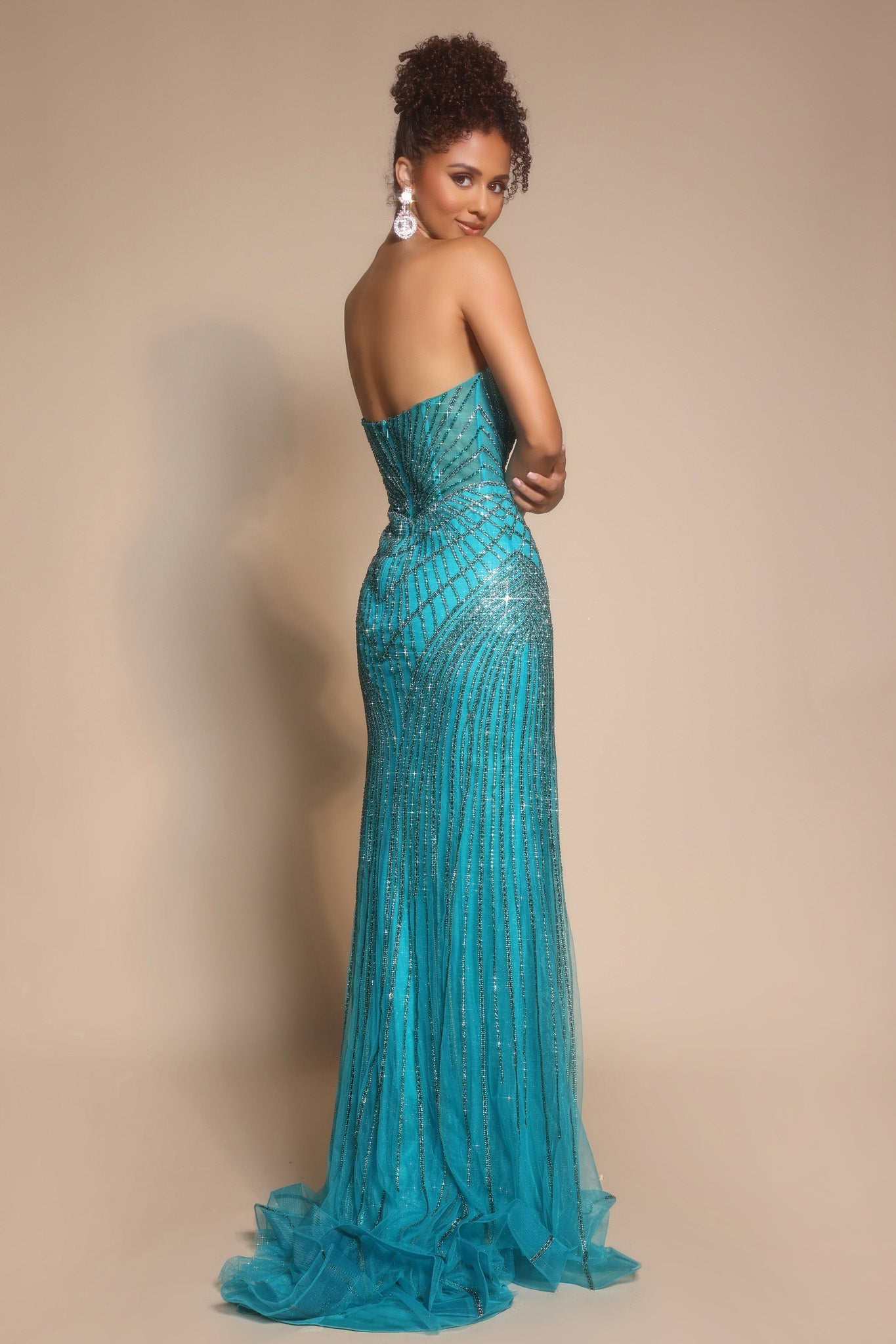 Woman in peacock blue formal gown