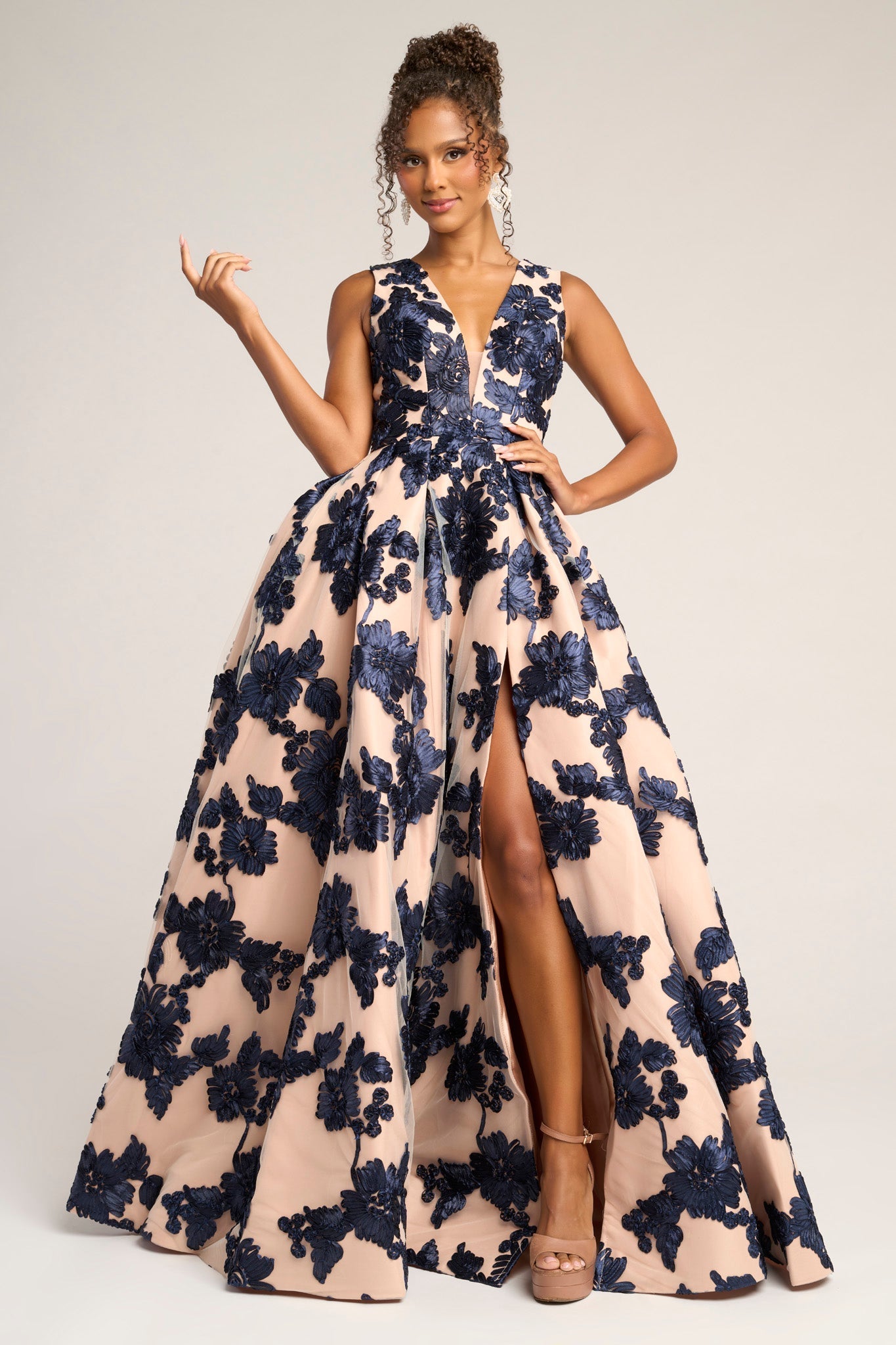 Navy and nude floral evening gown with high slit.