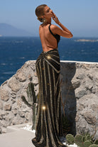 Black and gold formal dress with open back
