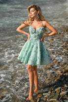 Mint green floral dress PS25703 on woman at the beach