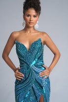 Peacock-inspired teal gown with model