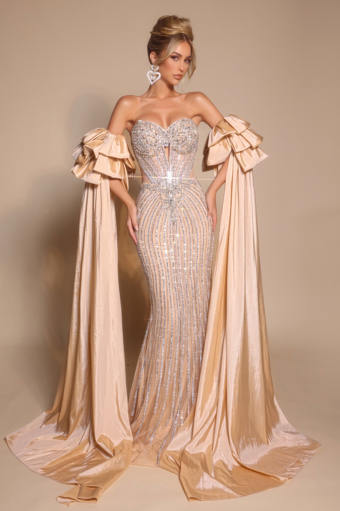 Champagne embellished formal gown with dramatic sleeves