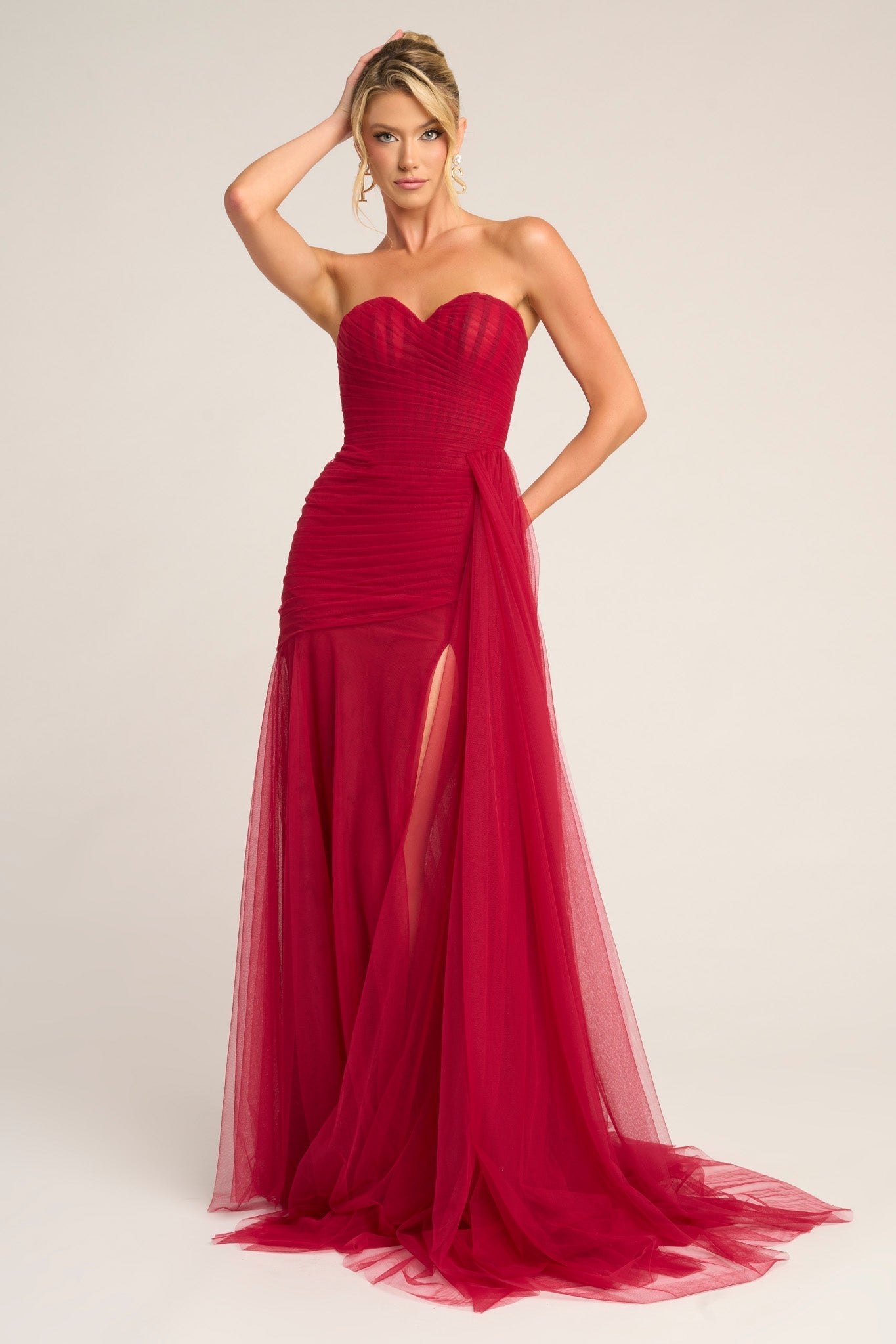 Red strapless gown PS26307E with high slit.