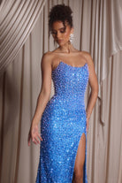 Blue beaded strapless gown with high slit.