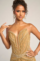 Gold beaded gown on model