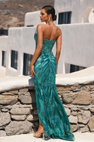 Woman in peacock tone sequin gown