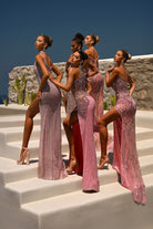 Pink and silver embellished gowns on models