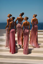 Pink and silver evening gowns on models